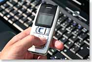 Picture of a cellphone and PC keyboard